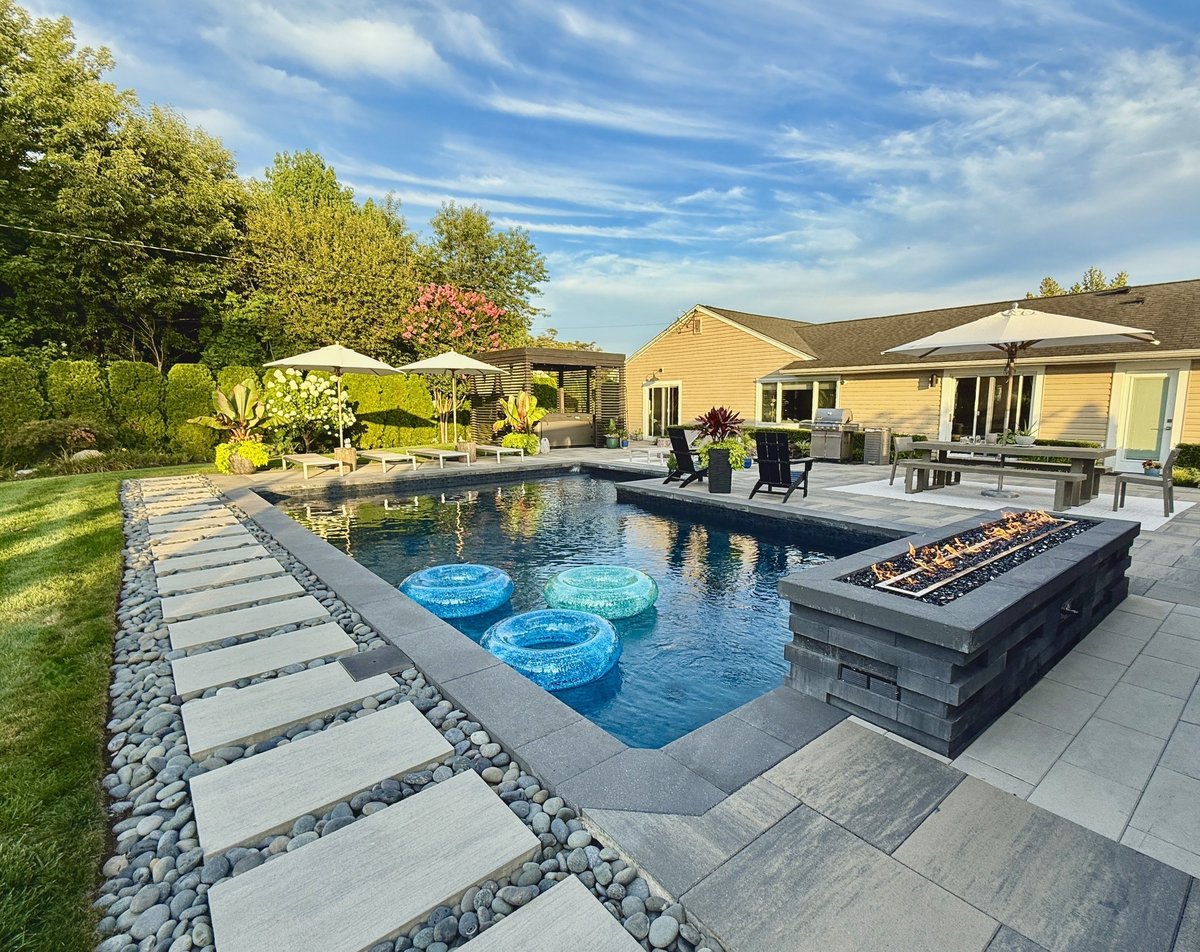 Luxurious outdoor living space with modern seating and dining area