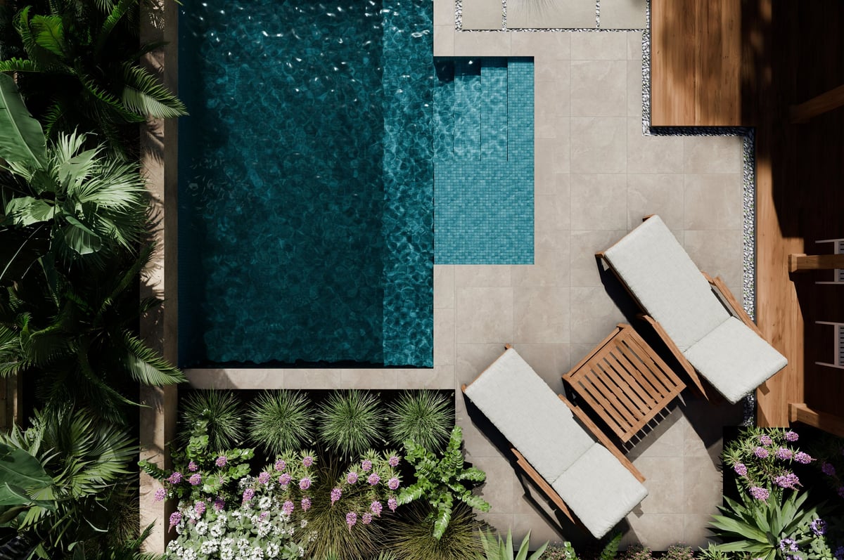 Aerial view of luxury swimming pool with tropical palms and modern landscaping